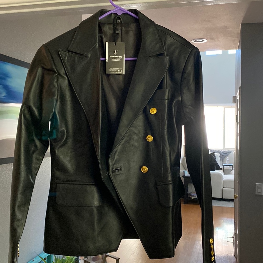 Woman’s leather double breasted blazer jacket.